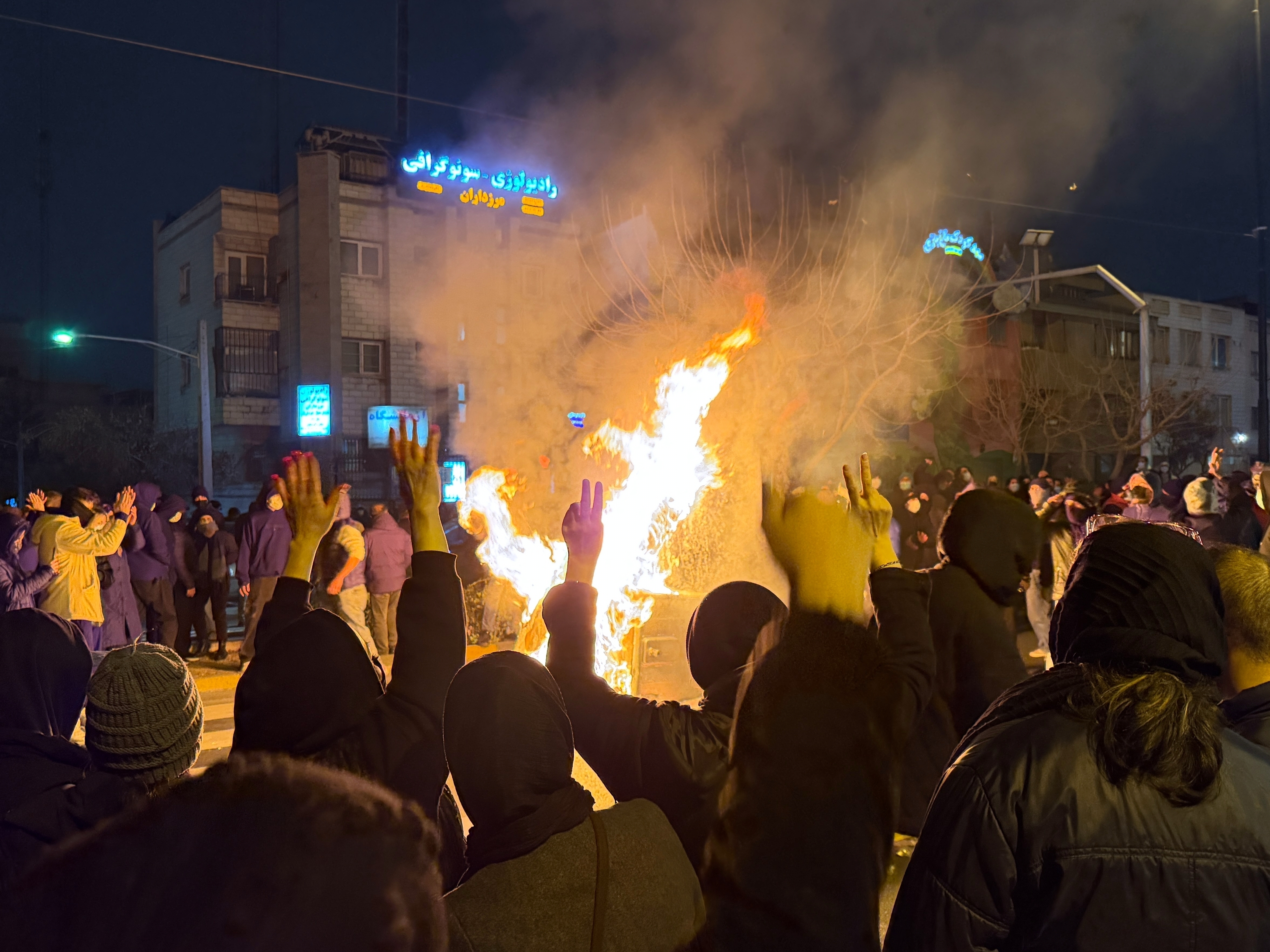 caption: In this photo obtained by The Associated Press, Iranians attend an anti-government protest in Tehran, Iran, Friday, Jan. 9, 2026.