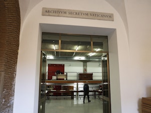 caption: A marble plaque over the main entrance of the Vatican Archives reads in Latin "Secret Vatican Archive." The Vatican's library on Pope Pius XII and his record during the Holocaust opened to researchers in March.