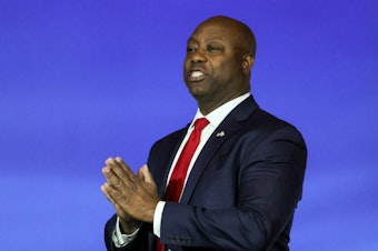 caption: Then-Republican presidential candidate Sen. Tim Scott of South Carolina arrives at an event in Las Vegas in October 2023. Scott is planning to endorse former President Donald Trump's reelection bid.