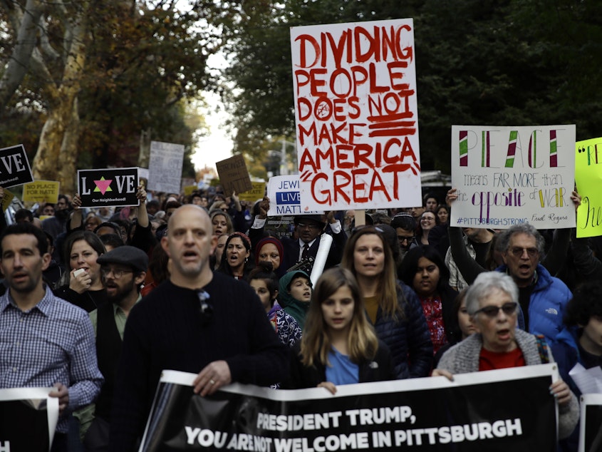 caption: Protesters demonstrate near Pittsburgh's Tree of Life Synagogue where President Trump paid respects on Tuesday. The shooting there and heated reactions to it added to the anxiety leading up to the midterm vote.