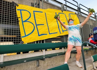 caption: Jim Allen, also known as Broccoli Guy, became the heart of the BELIEVE cheer section as the Mariners chased a 2021 playoff spot. 