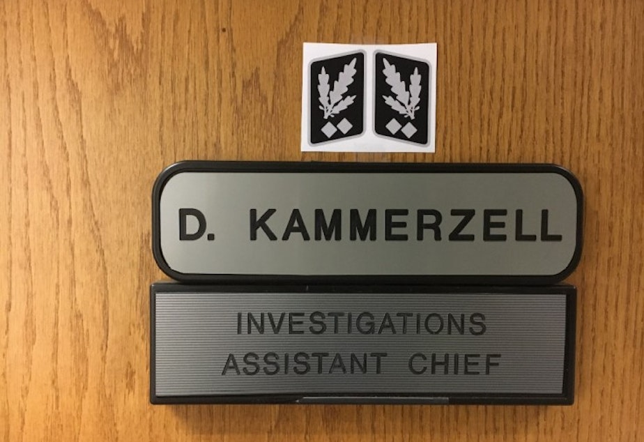 caption: Kent Assistant Police Chief Derek Kammerzell posted Nazi rank insignia on his office door for two weeks in September 2020 until an officer complained.