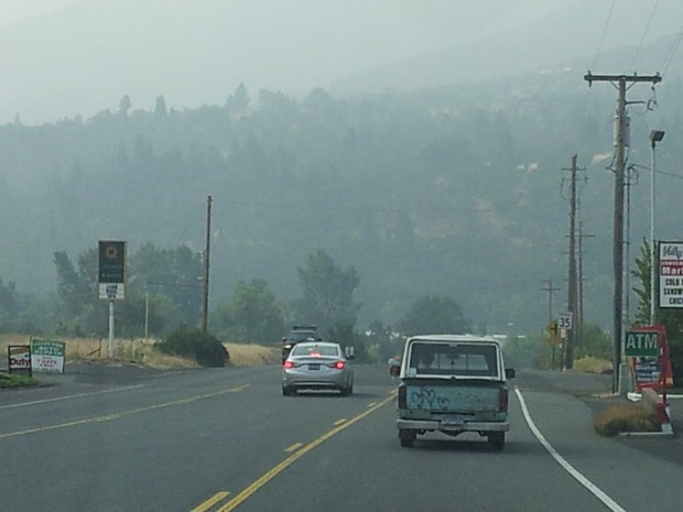 caption: <p>Driving into Ashland, Oregon, the hills are shrouded in wildfire smoke.</p>