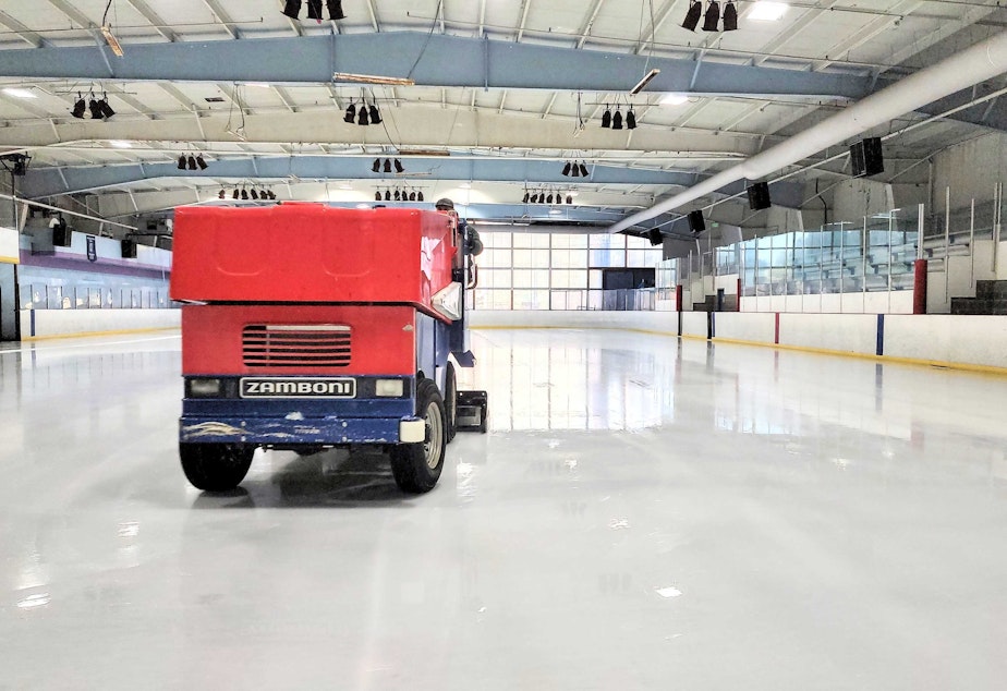 caption: A Zamboni driver polishes the ice at Highland Ice Arena on Wednesday, Oct. 12, 2022.