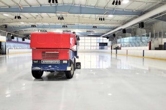 caption: A Zamboni driver polishes the ice at Highland Ice Arena on Wednesday, Oct. 12, 2022.