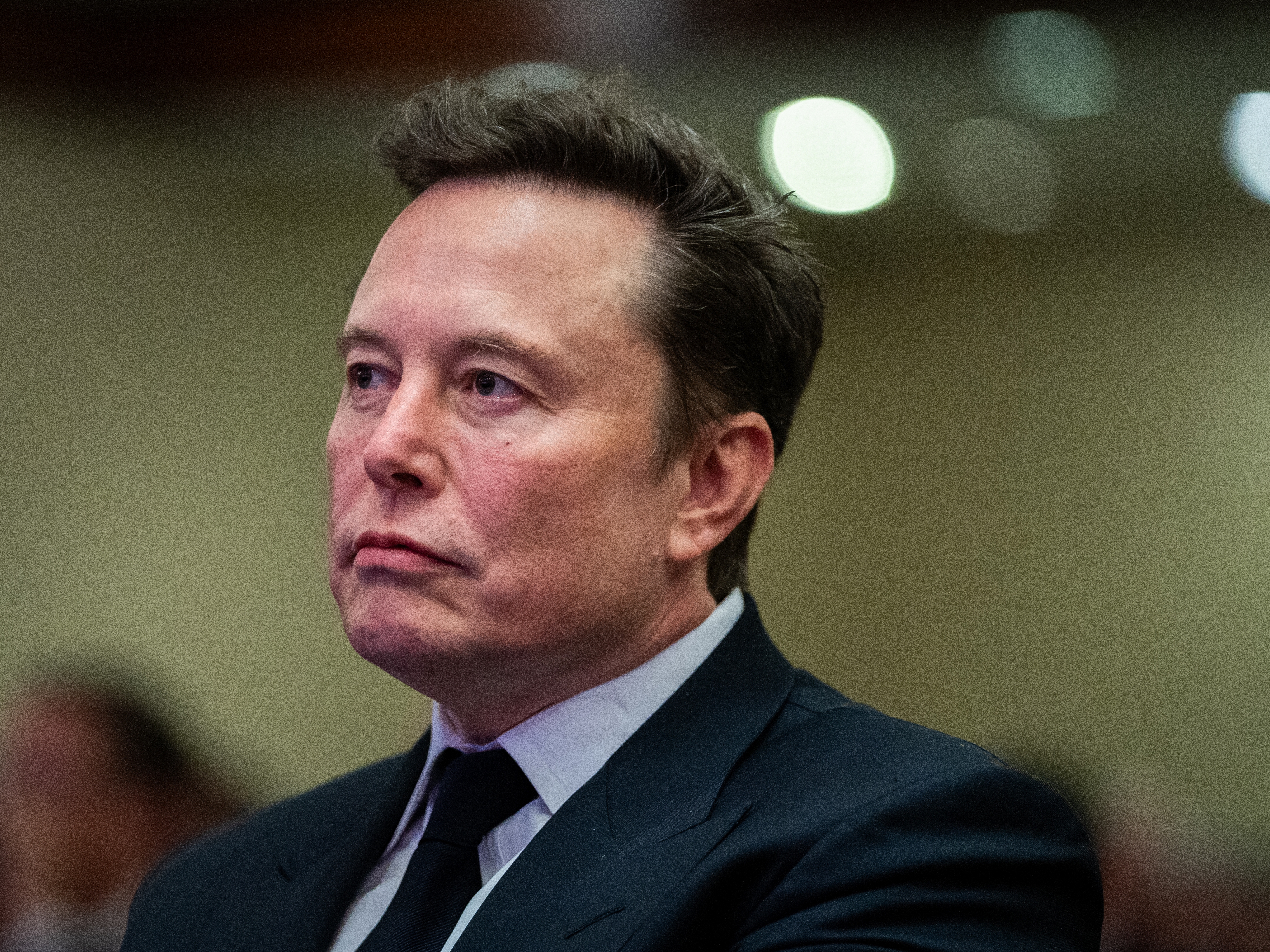 caption: Elon Musk attends a House Republicans Conference meeting at the Hyatt Regency on Capitol Hill on November 13. A federal judge this week ruled that Musk's $50 billion pay package from Tesla cannot be reinstated.