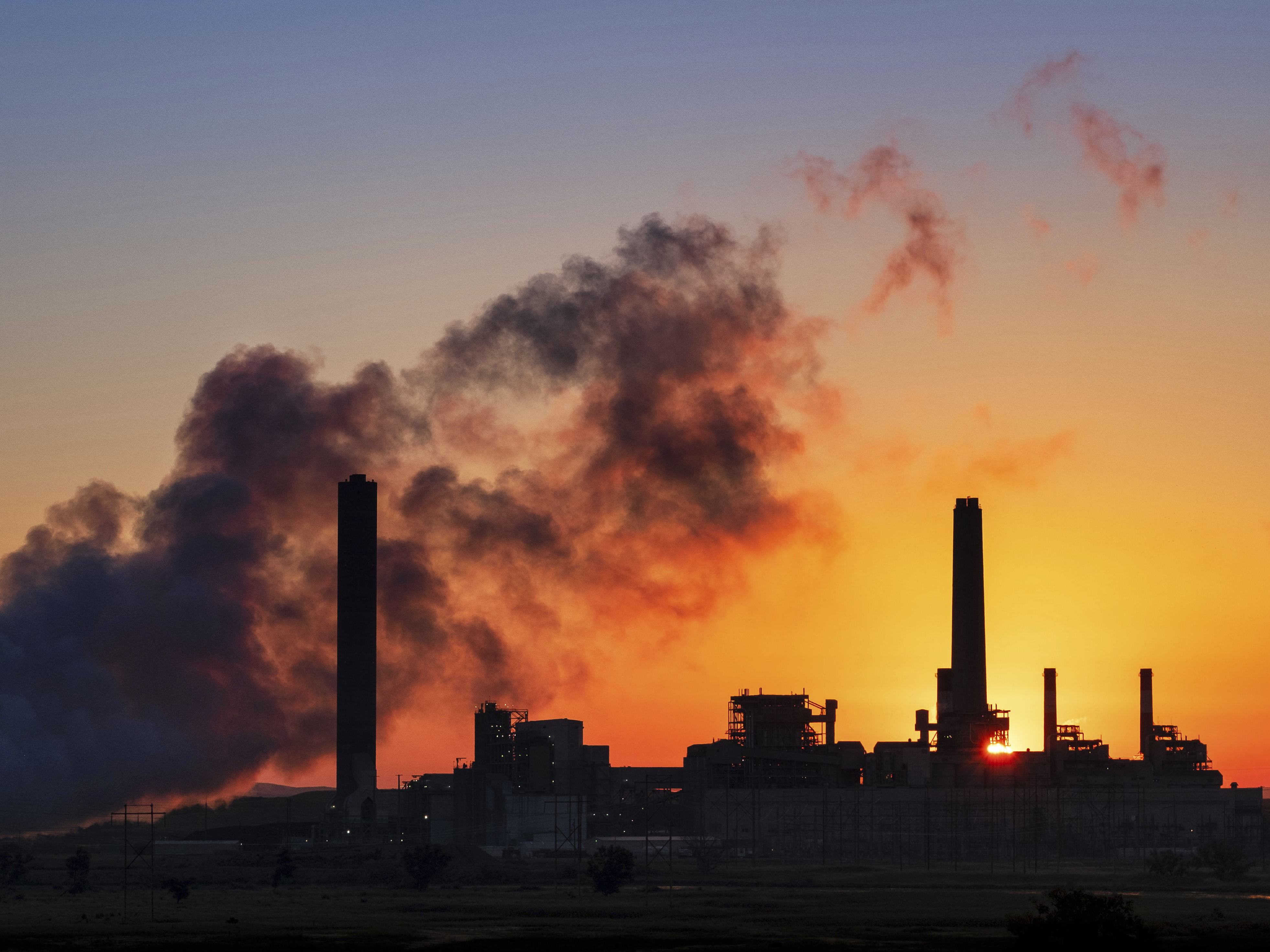 caption: The Dave Johnson coal-fired power plant in Glenrock, Wyo. The Trump administration is replacing one of President Obama's signature climate plans with a weaker version that could let some coal plants stay open longer.