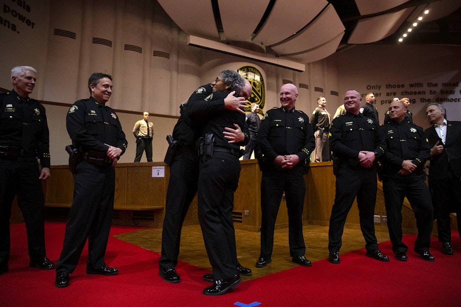 caption: King County Sheriff Patti Cole-Tindall, center, graduated from the 720-hour Basic Law Enforcement Academy on Tuesday, March 28, 2023, at the Washington State Criminal Justice Commission in Burien. 