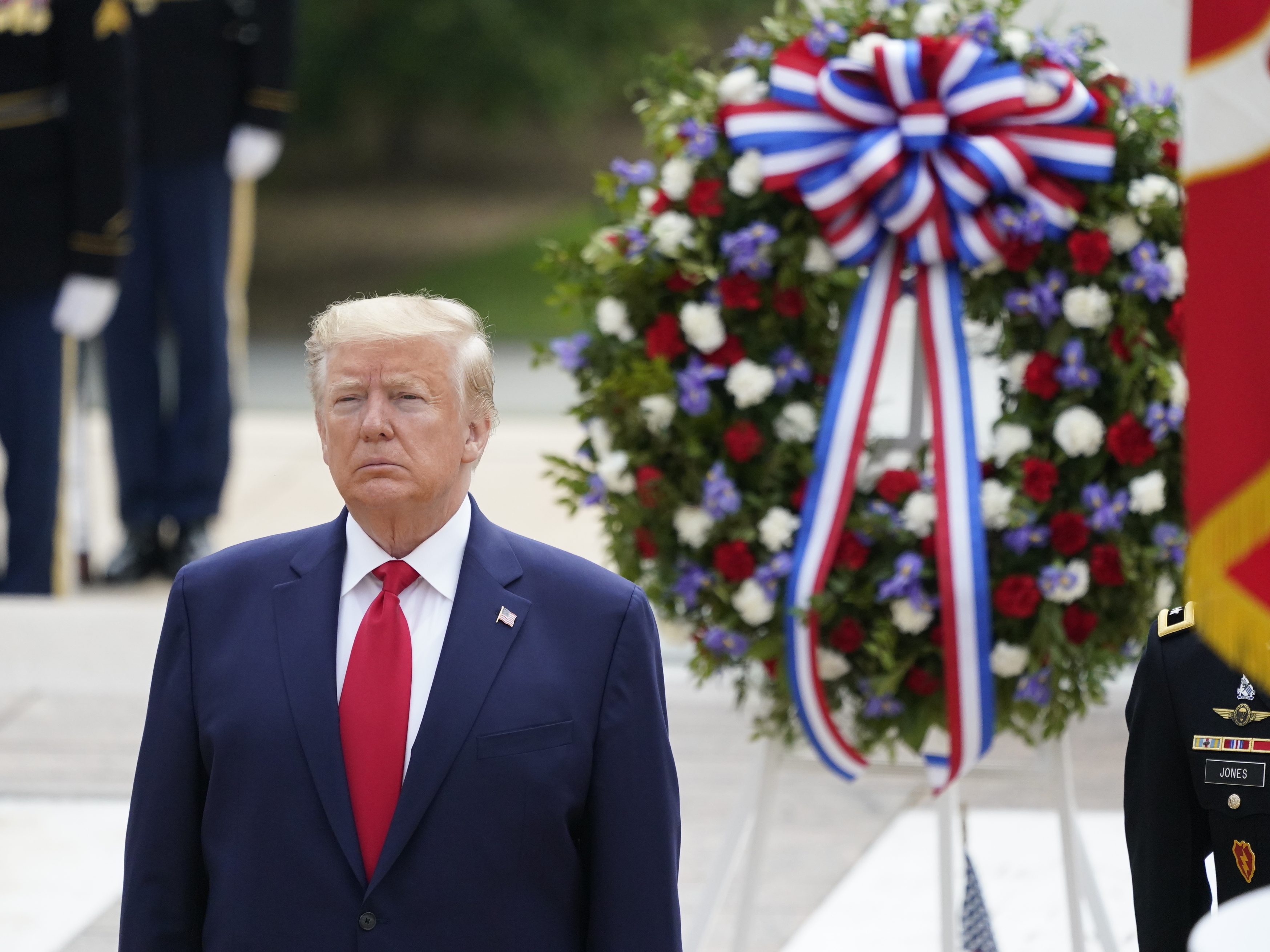 caption: President Donald Trump participates in a wreath laying ceremony at Arlington National Cemetery on Monday. Trump went on to deliver Memorial Day remarks at Fort McHenry in Baltimore.