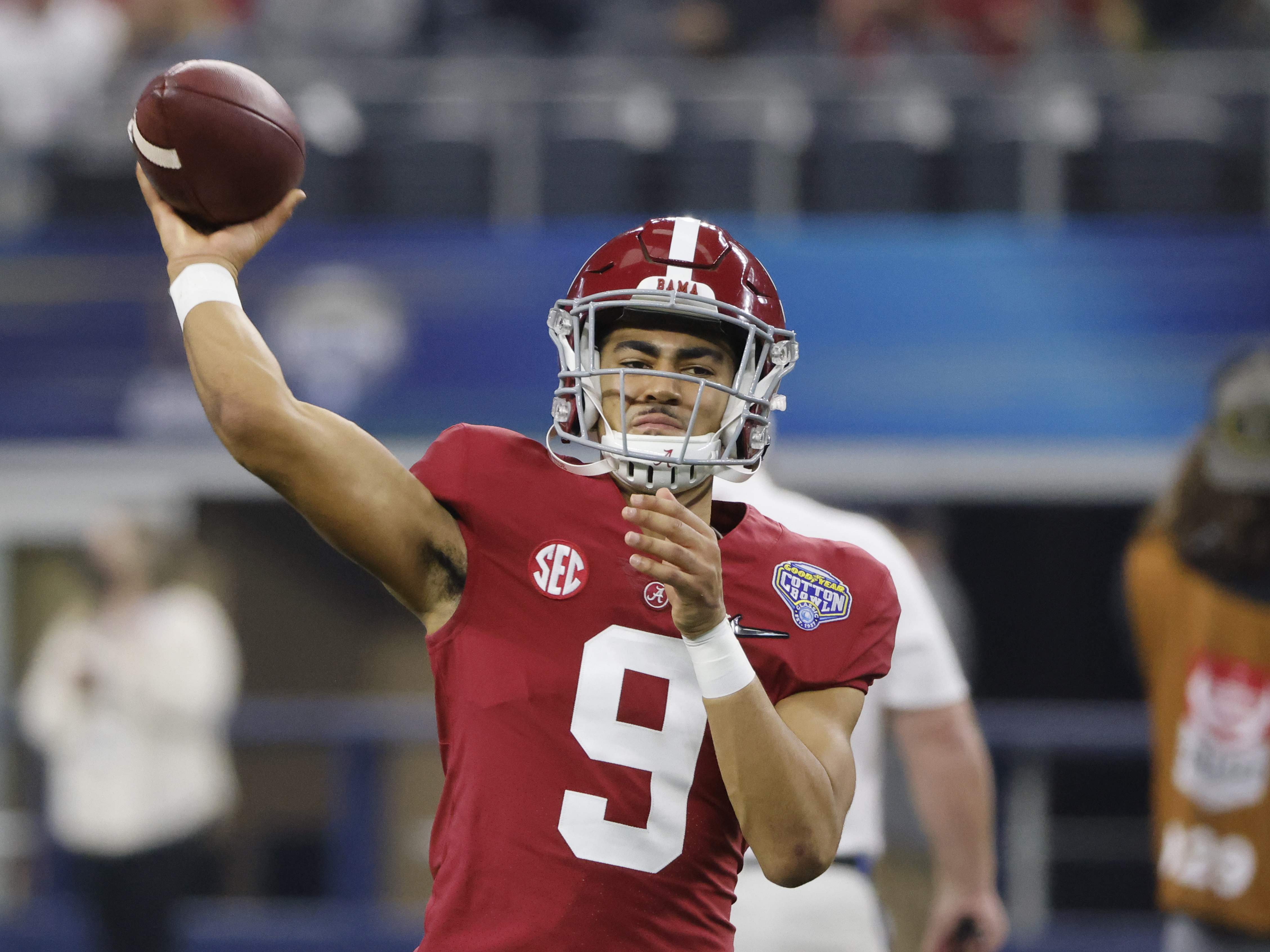 caption: Alabama quarterback Bryce Young throws a pass against Cincinnati during the Cotton Bowl on Dec. 31, 2021, in Arlington, Texas.