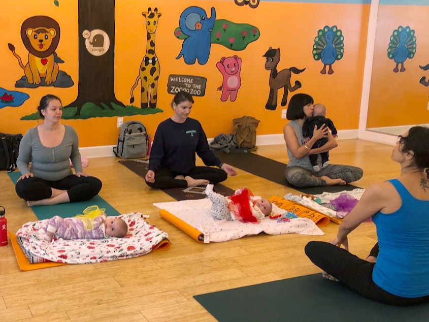 caption: In 2018, U.S. birthrates fell for nearly all racial and age groups, the CDC says. Here, mothers and babies attend a yoga class in Culver City, Calif., in March.