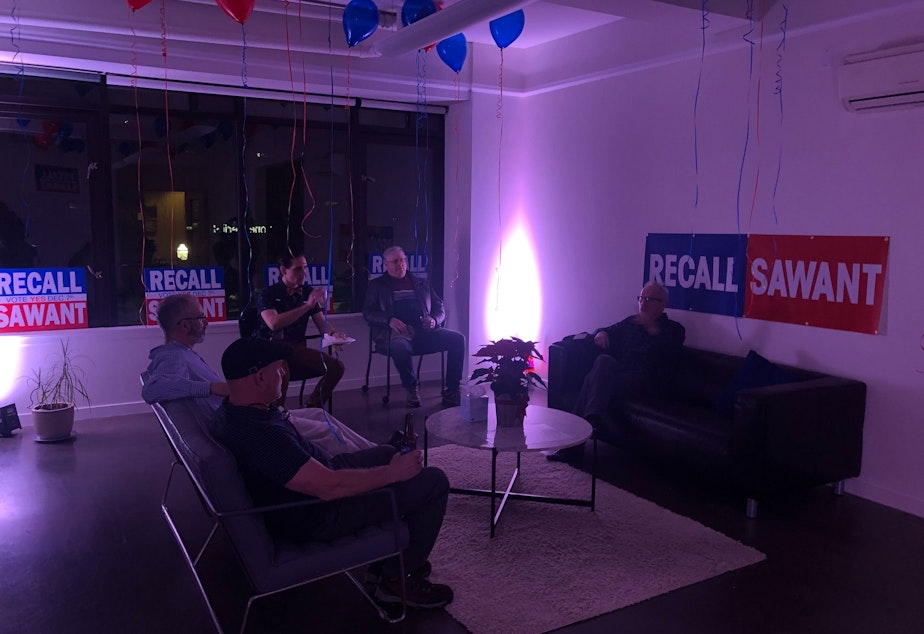caption: Supporters of the "Recall Sawant" campaign, to oust the Socialist councilmember, gather for its election night party on December 7, 2021. The group says it received threats and was therefore not disclosing its location.