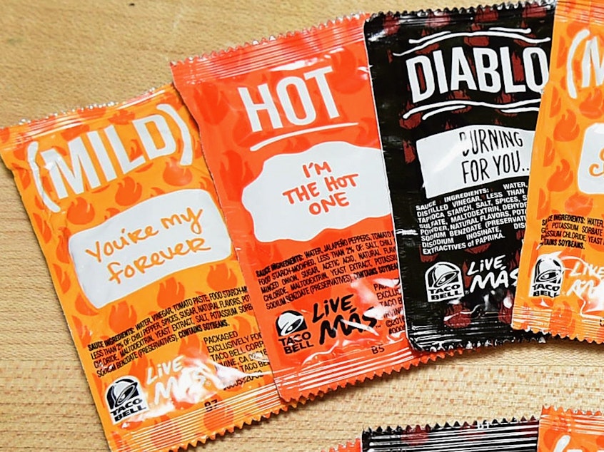 caption: Taco Bell wants customers to collect its sauce packets so they can be turned into other products rather than sent to the landfill.