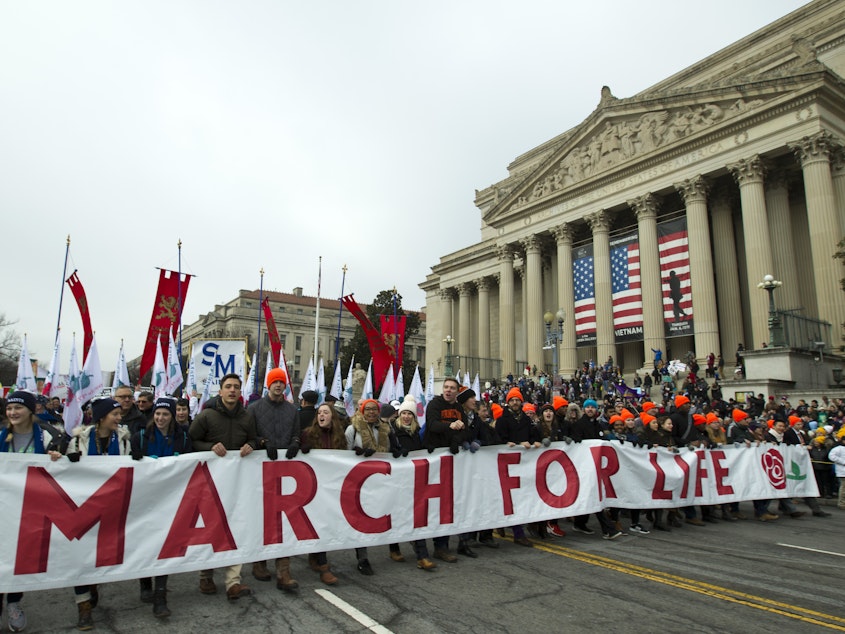caption: Anti-abortion activists march toward the U.S. Supreme Court during the 2019 March for Life in Washington, D.C. This year, President Trump is expected to speak at the rally.