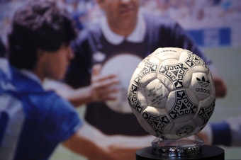 caption: The match ball used in the 1986 FIFA World Cup football match between Argentina and England is pictured ahead of its auction, at Wembley Stadium in London on Nov. 1.