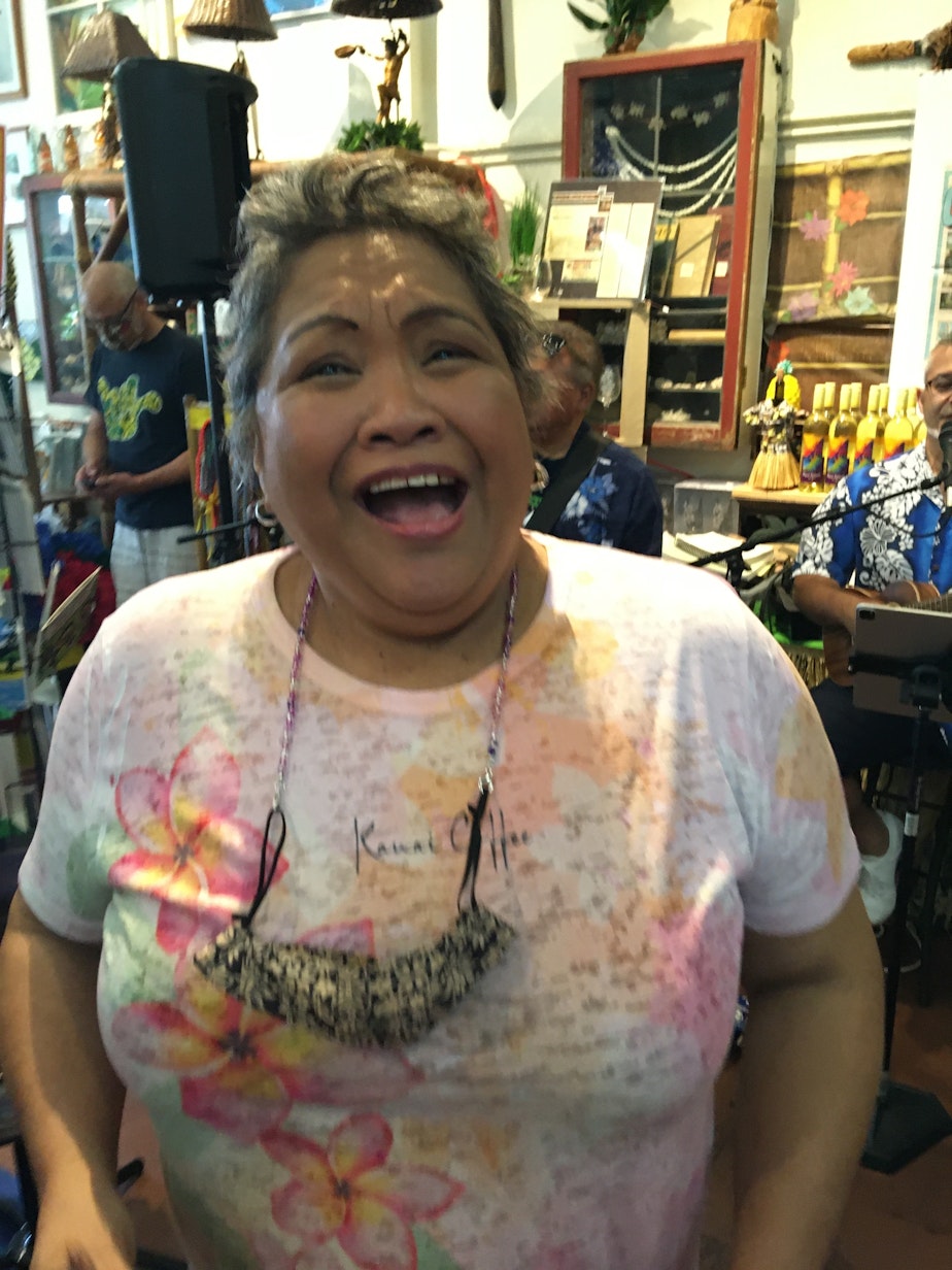 caption: Hawai'i General Store manager Dina Manatad is happy to have customers and lei return to the shop.