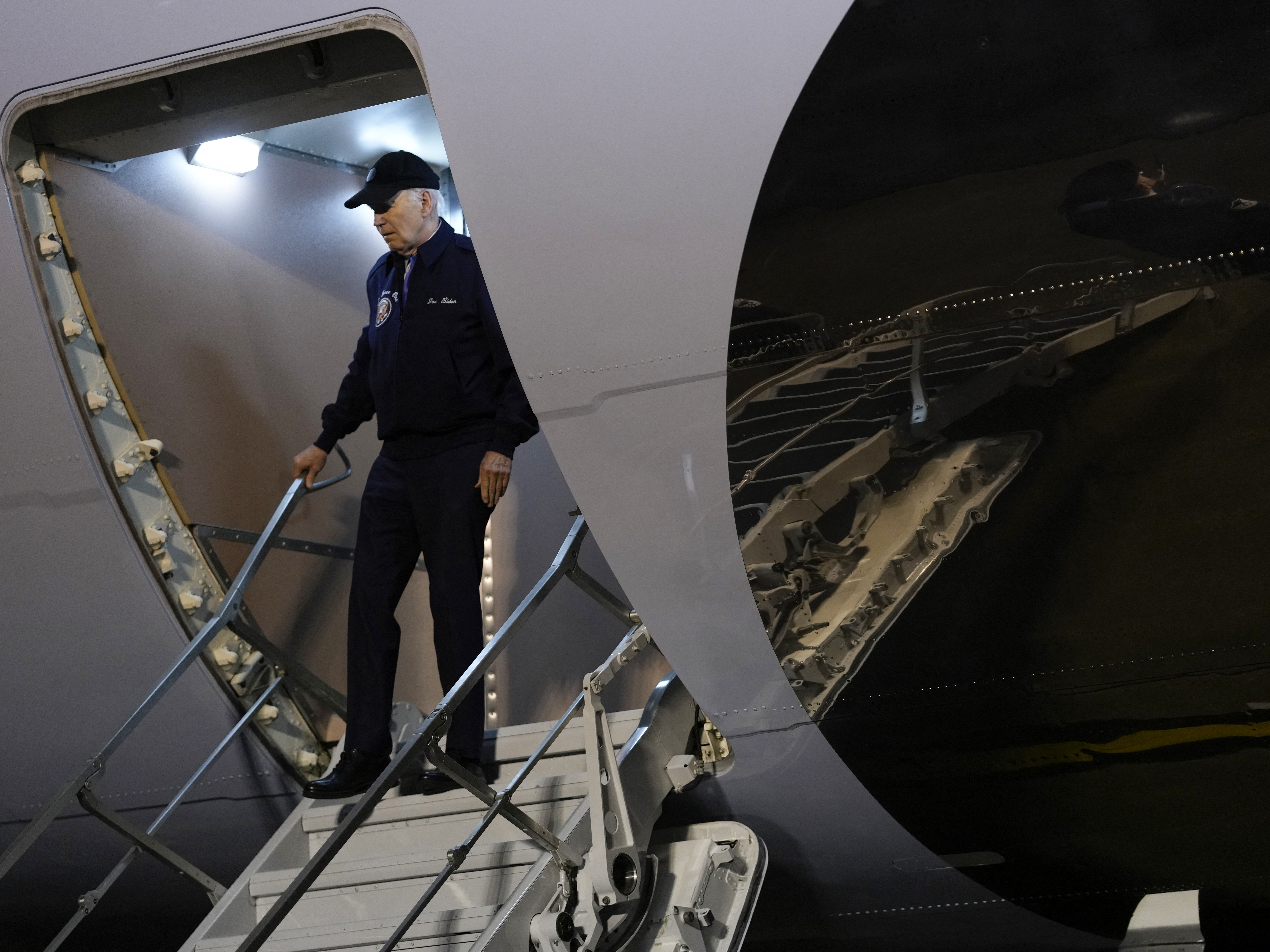 caption: President Biden steps off Air Force One at Dover Air Force Base in Delaware on July 17 as a case of COVID forced him off the campaign trail.