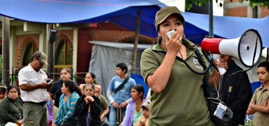 caption: A photo of Nestora Salgado from her website. The caption says it is a photo of her as the leader of the community police.