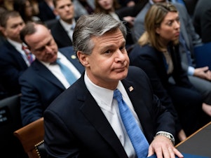 caption: FBI Director Christopher Wray, pictured on Capitol Hill on Feb. 5, is briefing House members on security threats on Thursday.