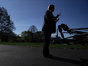 caption: President Trump speaks to the media prior to his departure from the White House Wednesday in Washington, D.C.