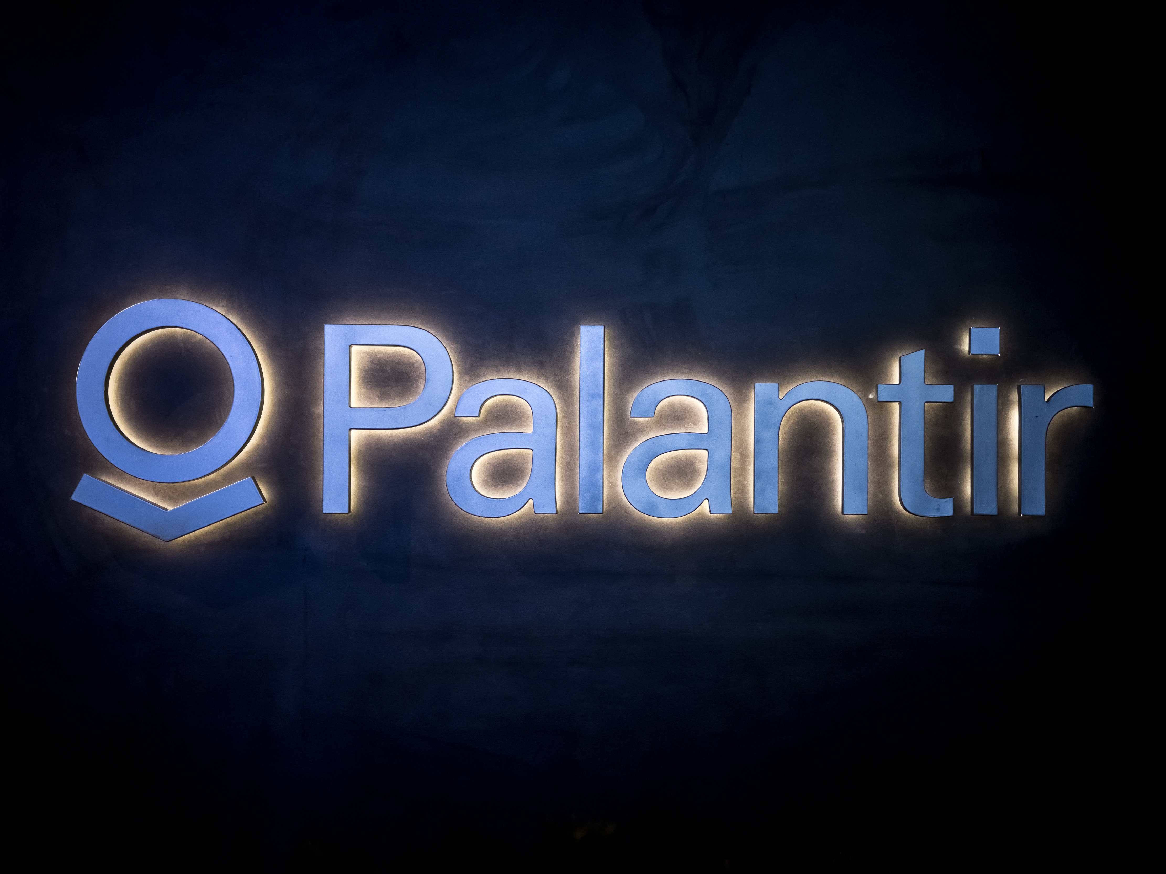 caption: The logo of the big data analytics software company Palantir Technologies on display during the World Economic Forum (WEF) annual meeting in Davos, on Jan. 23, 2025.
