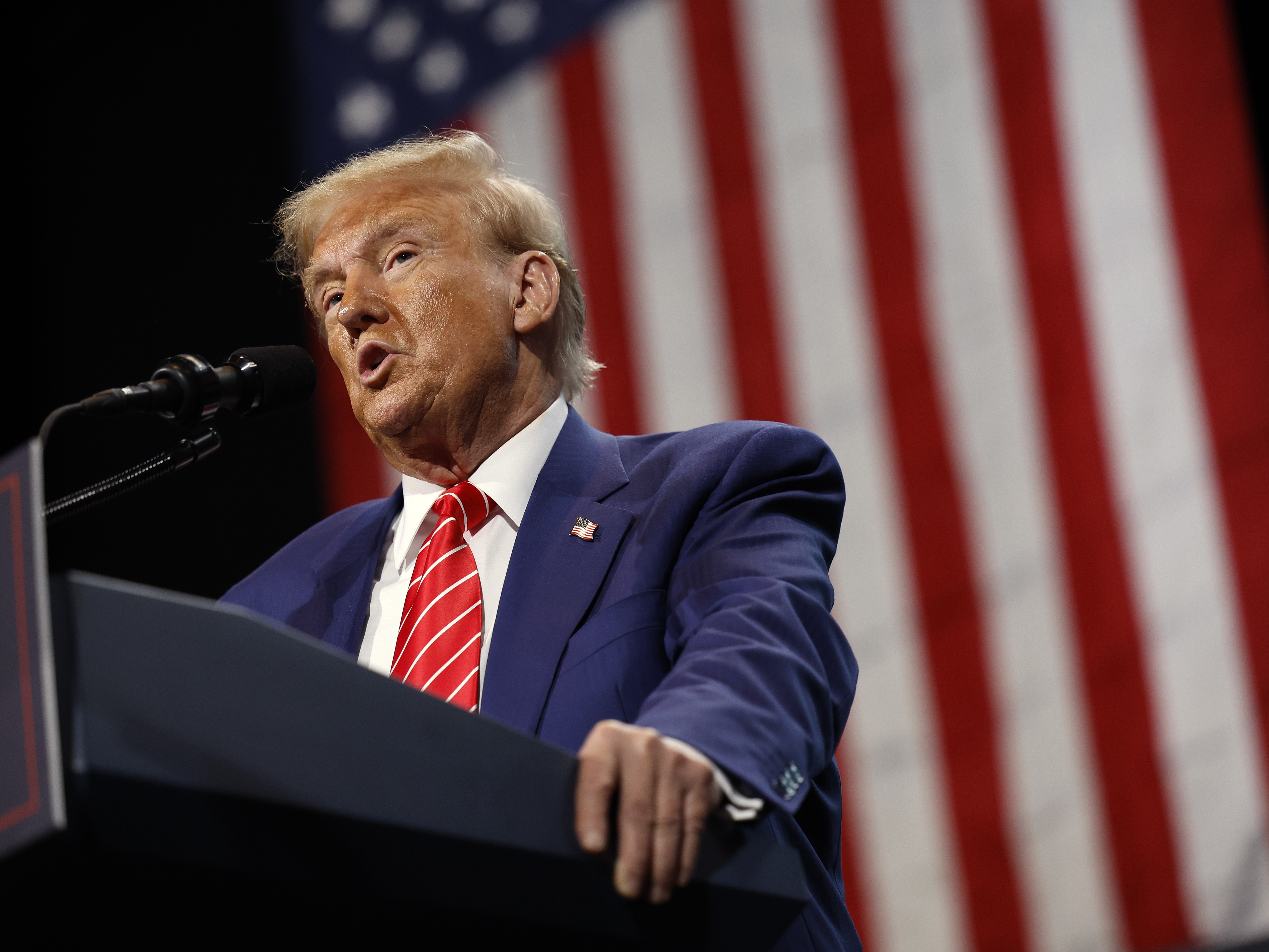 caption: Former President Donald Trump delivers remarks during a campaign rally in Atlanta on Oct. 15. With the election in its closing weeks, Trump and other Republican candidates have been  focusing many of their campaign ads around the issue of transgender rights.