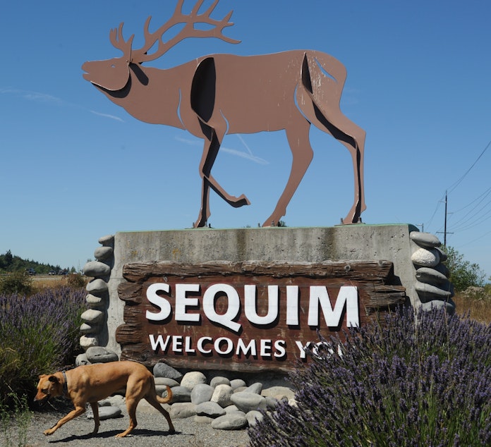 caption: A sign on Highway 101 welcomes visitors to Sequim, Washington. 