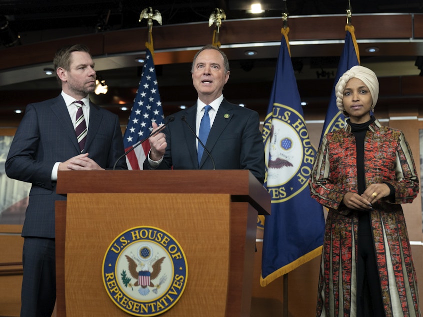 caption: Rep. Adam Schiff, D-Calif., center, with Rep. Eric Swalwell, D-Calif., left, and Rep. Ilhan Omar, D-Minn., during a news conference on Capitol Hill in Washington on Wednesday.