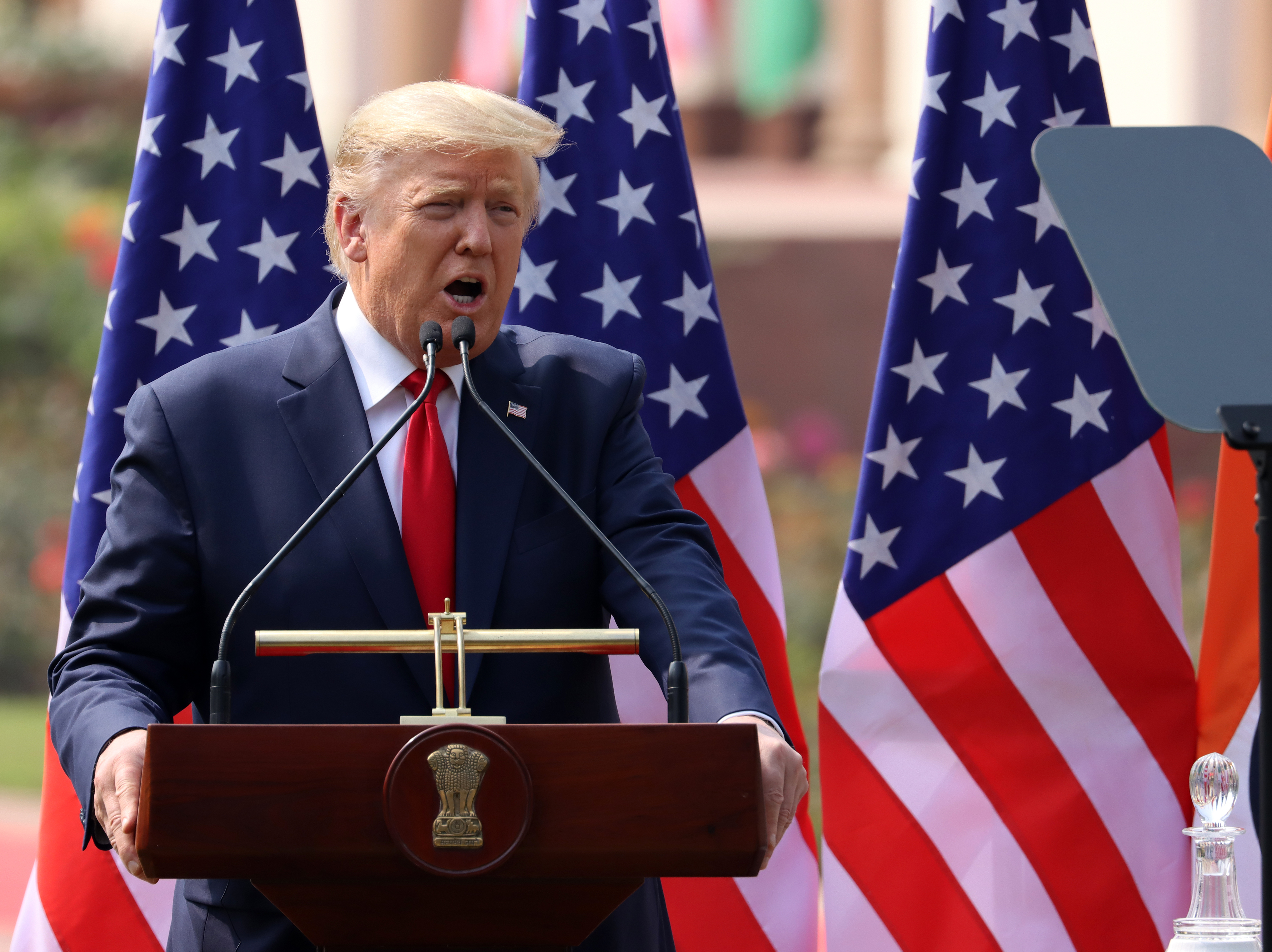 caption: President Trump, pictured in New Delhi on Tuesday, will hold a news conference on Wednesday to discuss the threat of coronavirus.