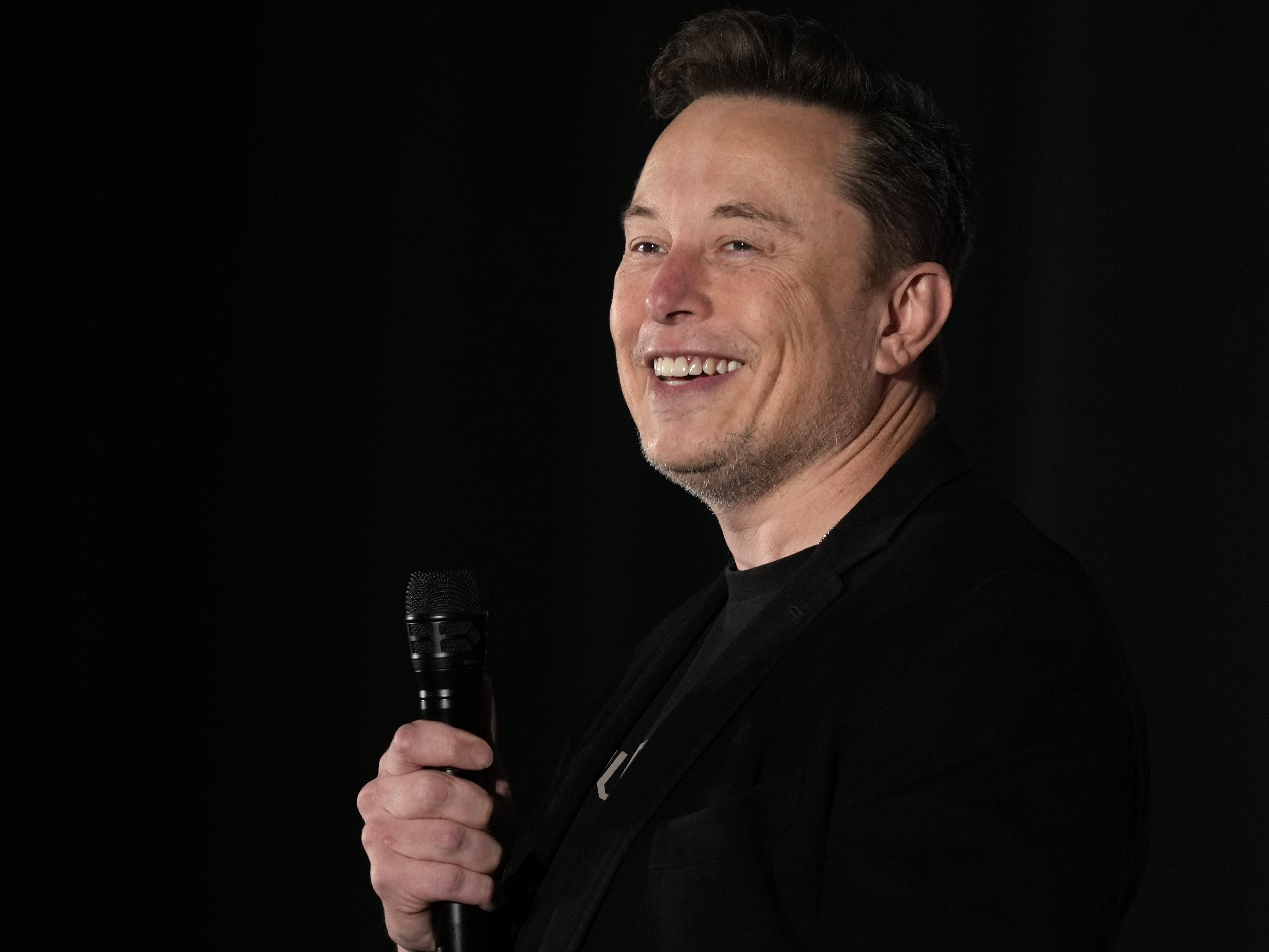 caption: Elon Musk speaks as part of a campaign town hall in support of Donald Trump in Folsom, Pa., on Oct. 17, 2024.