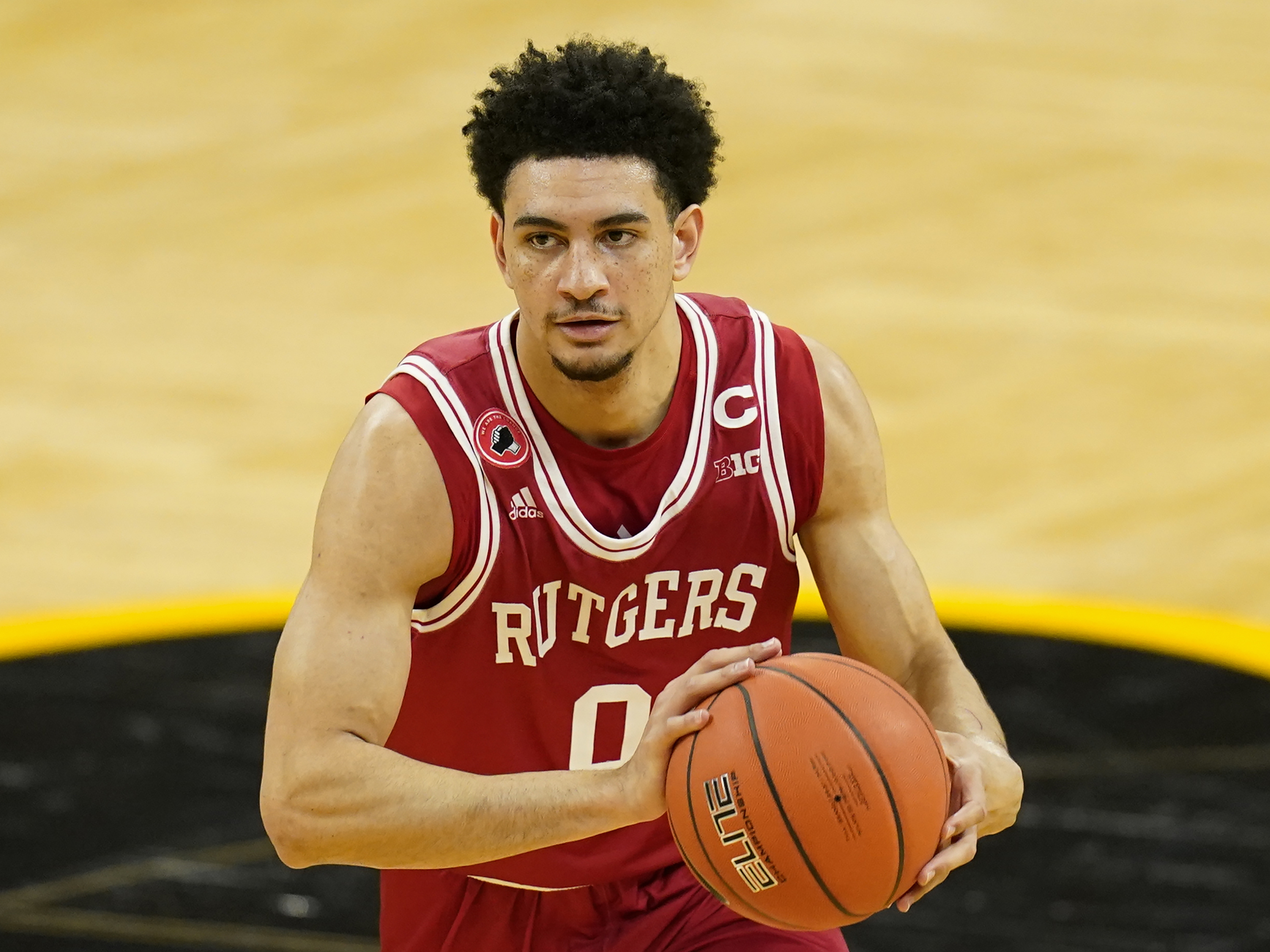 caption: Rutgers guard Geo Baker, seen here last month, is one of the college basketball players leading a protest against the NCAA's rules preventing players from profiting from their own name, image and likeness.