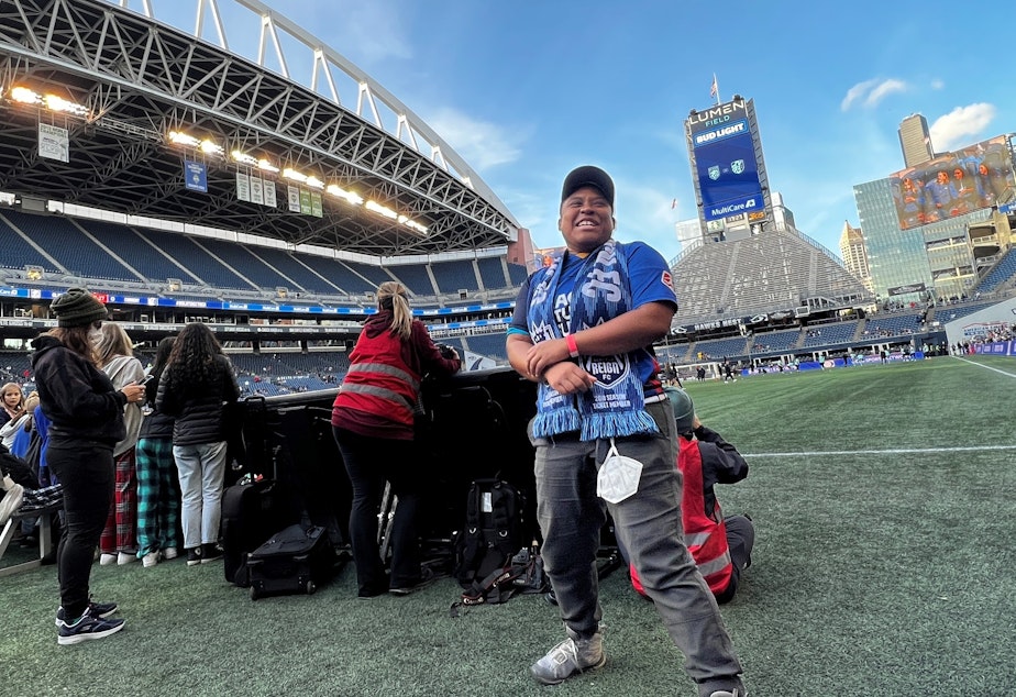 caption: Jai Hillard has attended Reign games since 2018, back when the team played at Memorial Stadium in Seattle Center.