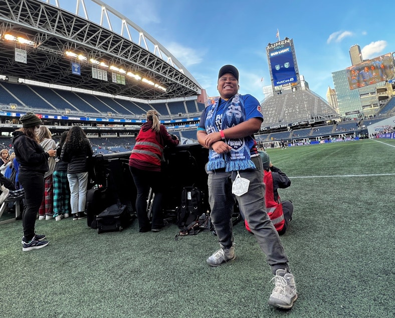 caption: Jai Hillard has attended Reign games since 2018, back when the team played at Memorial Stadium in Seattle Center.