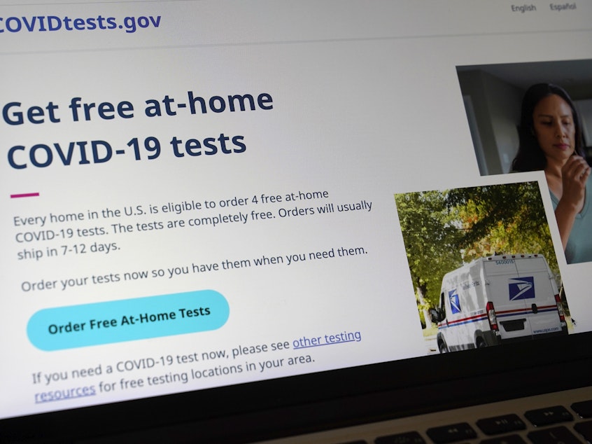caption: The website COVIDTests.gov allows people to order four at-home tests per residence and have them delivered by mail. Now there's a phone number, too.