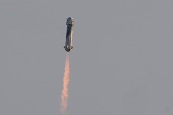 caption: Blue Origin's New Shepard rocket launches on Tuesday morning, carrying passengers Jeff Bezos, founder of Amazon and space tourism company Blue Origin; his brother, Mark Bezos; 82-year-old female aviation pioneer Wally Funk; and 18-year-old Oliver Daemen from its spaceport near Van Horn, Texas.