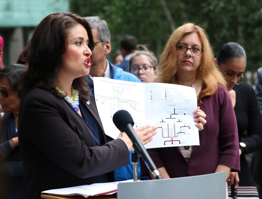 caption: Seattle City Councilmember Lorena González at a press conference on July 15, 2019, explains the complex accountability process following police violence.