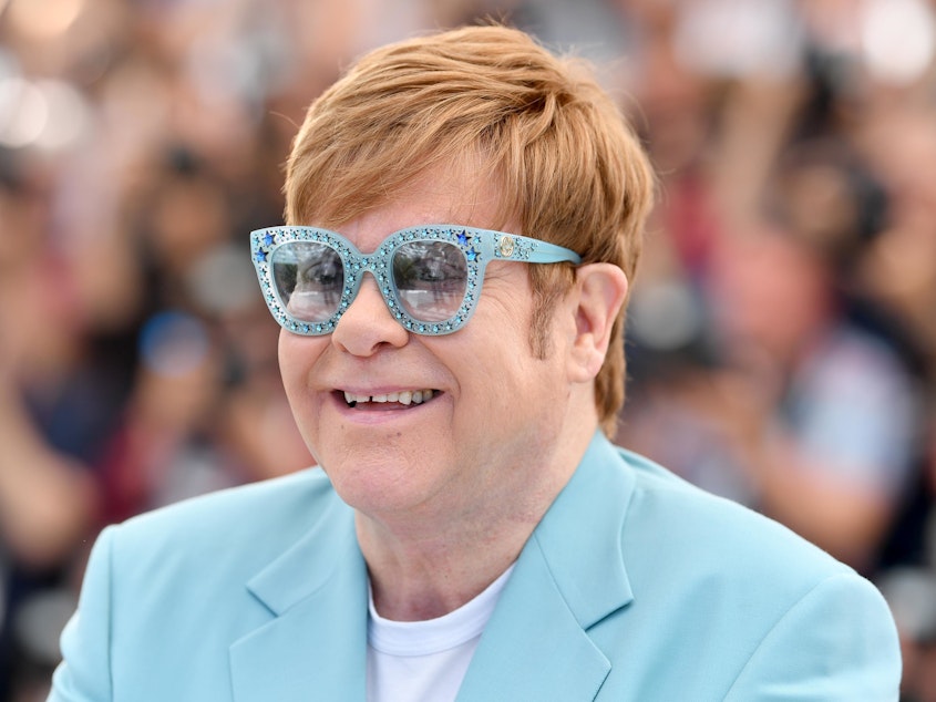 caption: Elton John attends the photocall for the movie "Rocketman" during the 72nd annual Cannes Film Festival on May 16, 2019 in Cannes, France.