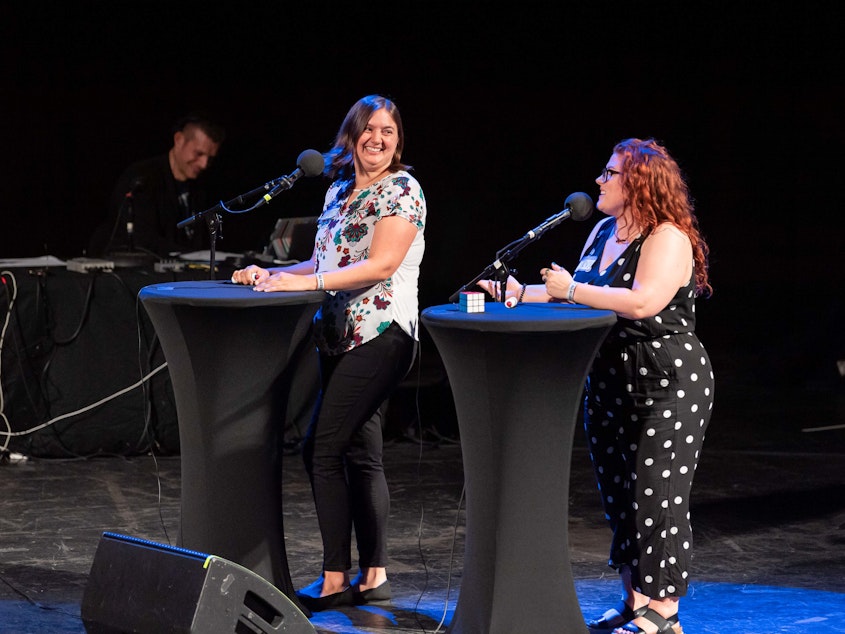 caption: Contestants Clairissa Simmons and Stevie Tardiff go head-to-head on <em>Ask Me Another</em> at the Aztec Theatre in San Antonio, Texas.