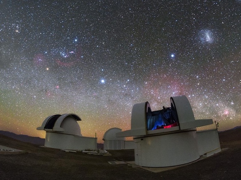 caption: The telescopes of the SPECULOOS Southern Observatory in the Atacama Desert, Chile. The telescopes were used to confirm and characterize a new planet discovered by NASA, which led to the discovery of another nearby planet.