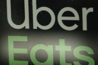 caption: Uber Eats is in talks with Grubhub about a possible acquisition. Analysts say such a merger would make the combined company the dominant player in food delivery.