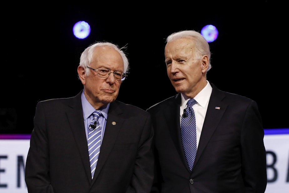 caption: Sen. Bernie Sanders, I-Vt., former Vice President Joe Biden, talk before a Democratic presidential primary debate, Feb. 25, 2020. 
Sanders is scheduled to speak at the Democratic National Convention on Monday, Aug. 17, 2020. Biden is slated to accept the party's nomination as the Democratic candidate for president later in the week. 