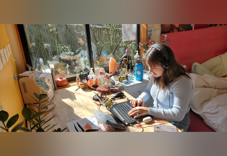 caption: Sophomore Charlotte Engrav has been attending online classes from her bedroom ever since school closed at the beginning of the month