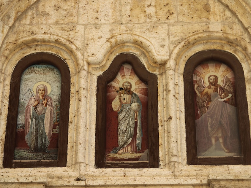 caption: Christian icons damaged by fighting are seen in a monastery in the village of Maaloula, north of Damascus, Syria. U.S. evangelicals are concerned that a pullout of U.S. troops will leave Syrian Christians vulnerable to attack.