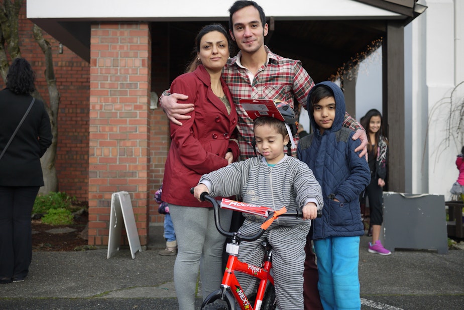 caption: This Iranian refugee family was resettled in Kent this year. It's their first Christmas in the U.S.