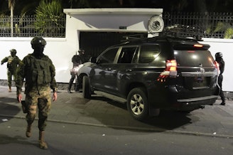 caption: Police attempt to break into the Mexican embassy in Quito, Ecuador, Friday, April 5, 2024, following Mexico's granting of asylum to former Ecuadorian Vice President Jorge Glas, who had sought refuge there.