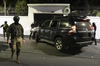 caption: Police attempt to break into the Mexican embassy in Quito, Ecuador, Friday, April 5, 2024, following Mexico's granting of asylum to former Ecuadorian Vice President Jorge Glas, who had sought refuge there.