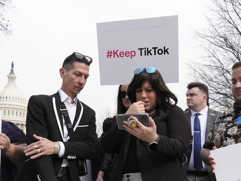 caption: Devotees of TikTok gather at the Capitol in Washington, as the House passed a bill that would lead to a nationwide ban of the popular video app if its China-based owner doesn't sell.