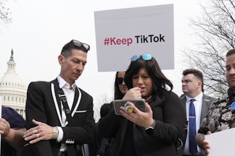 caption: Devotees of TikTok gather at the Capitol in Washington, as the House passed a bill that would lead to a nationwide ban of the popular video app if its China-based owner doesn't sell.