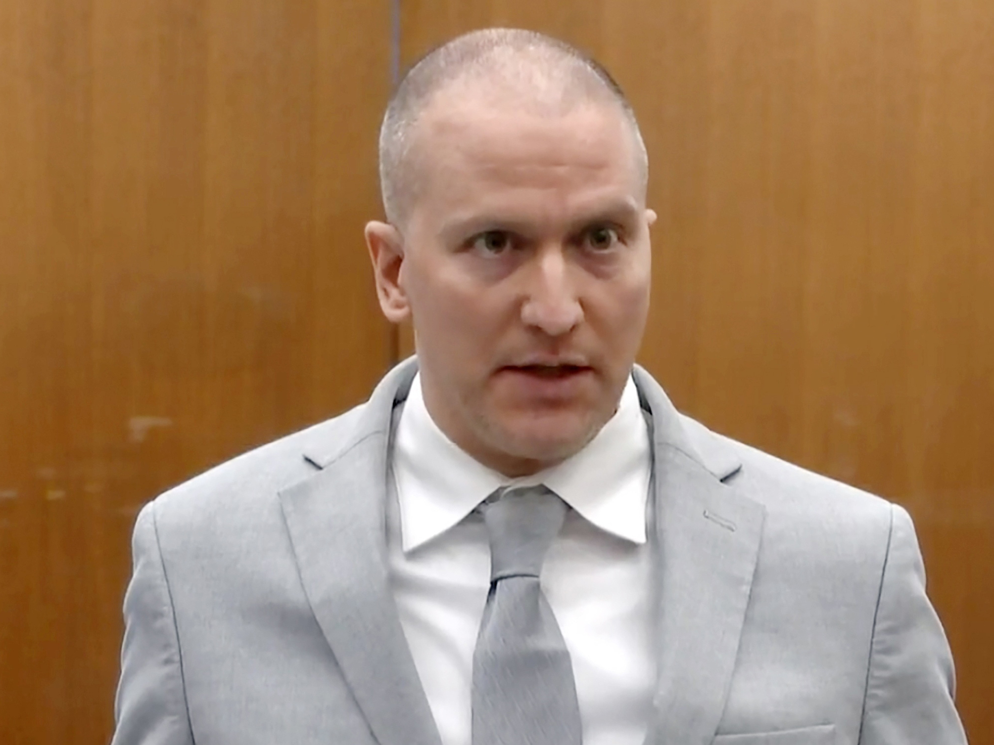 caption: In this image taken from video, former Minneapolis police Officer Derek Chauvin addresses the court at the Hennepin County Courthouse, June 25, 2021, in Minneapolis.