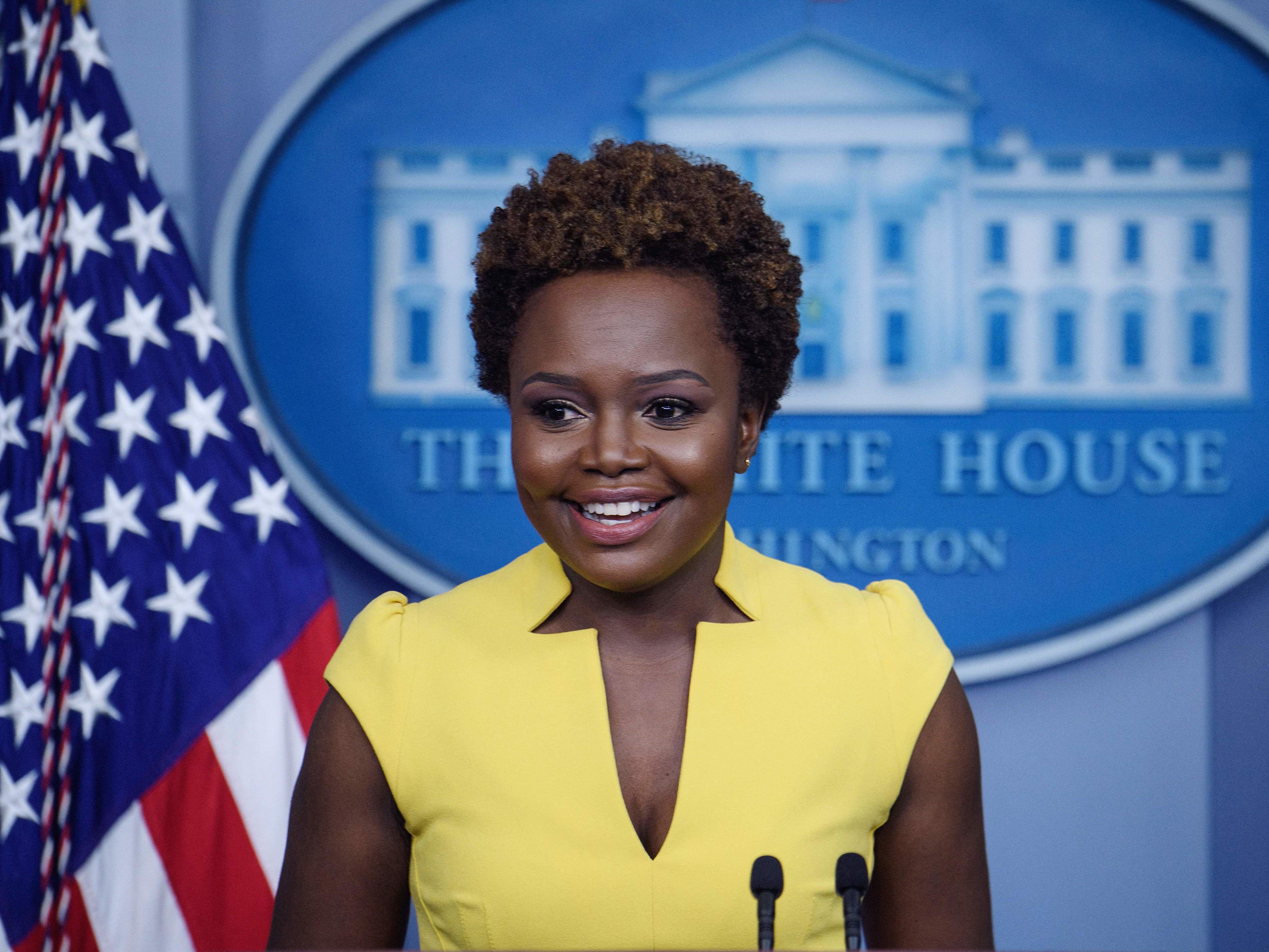 caption: White House principal deputy press secretary Karine Jean-Pierre arrives for the press briefing Wednesday. "I believe being behind this podium, being in this room, being in this building, is not about one person," she said of the historic nature of her turn in the briefing room.